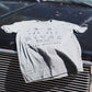 grey Rival Bros t-shirt on truck hood