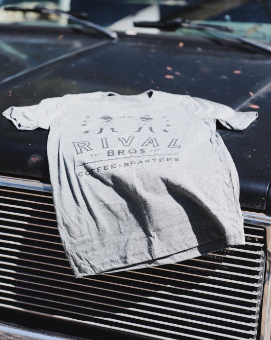 grey Rival Bros t-shirt on truck hood